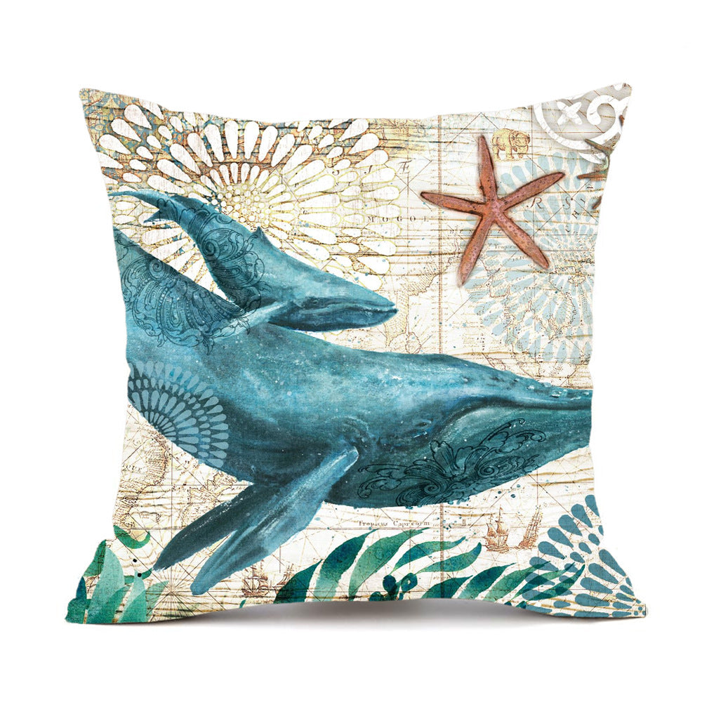 Decorative pillow with a whale design on a map background