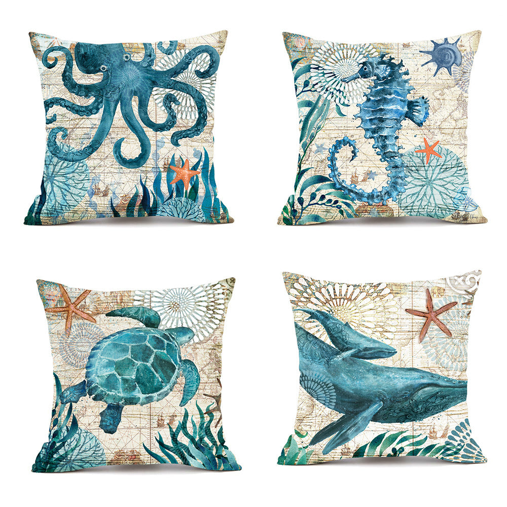 Set of four decorative pillows with ocean-themed designs on a white background.