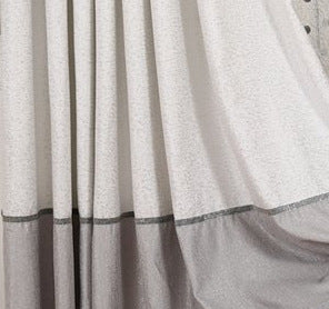 Close-up of a gray curtain with a textured pattern