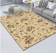 Beige floral patterned rug in a living room setting with a sofa and coffee table.