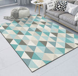 Geometric patterned rug in a living room with a sofa and coffee table.