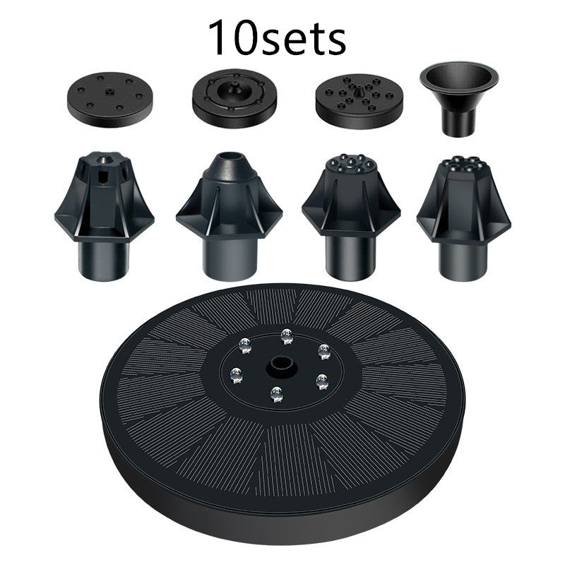 Set of black gardening tools including a large wheel and smaller components on a white background.