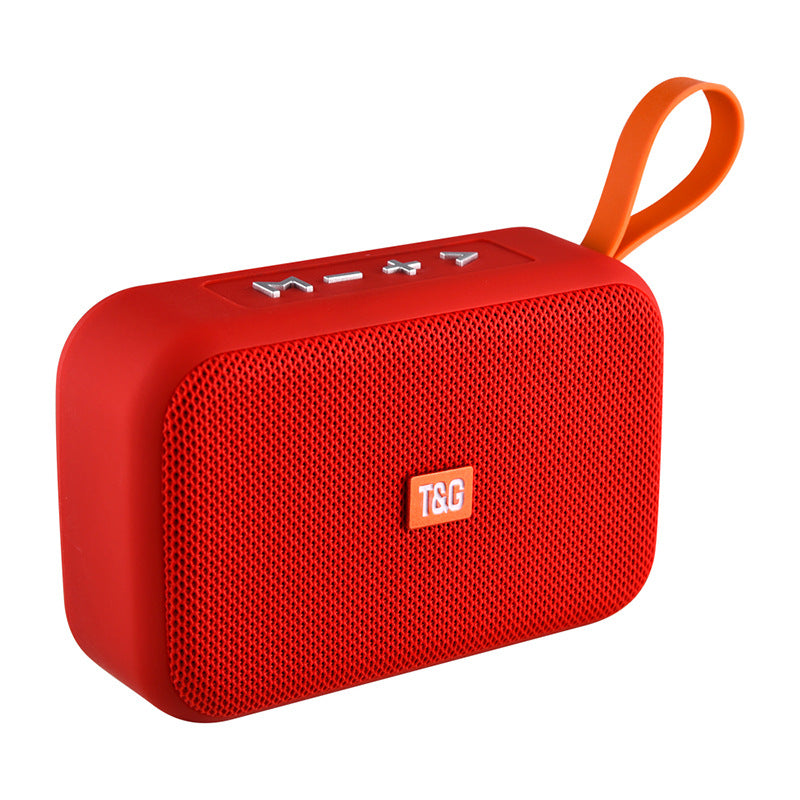 Red portable speaker with an orange handle on a white background