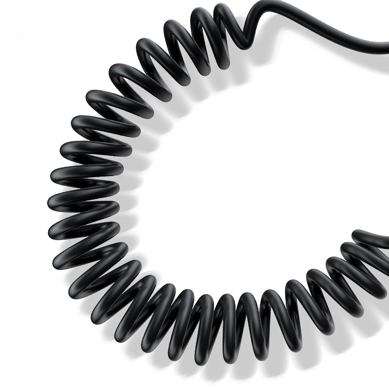 Coiled black cable on a white background