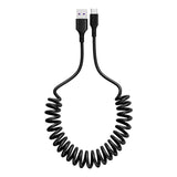 Coiled black USB cable on a white background