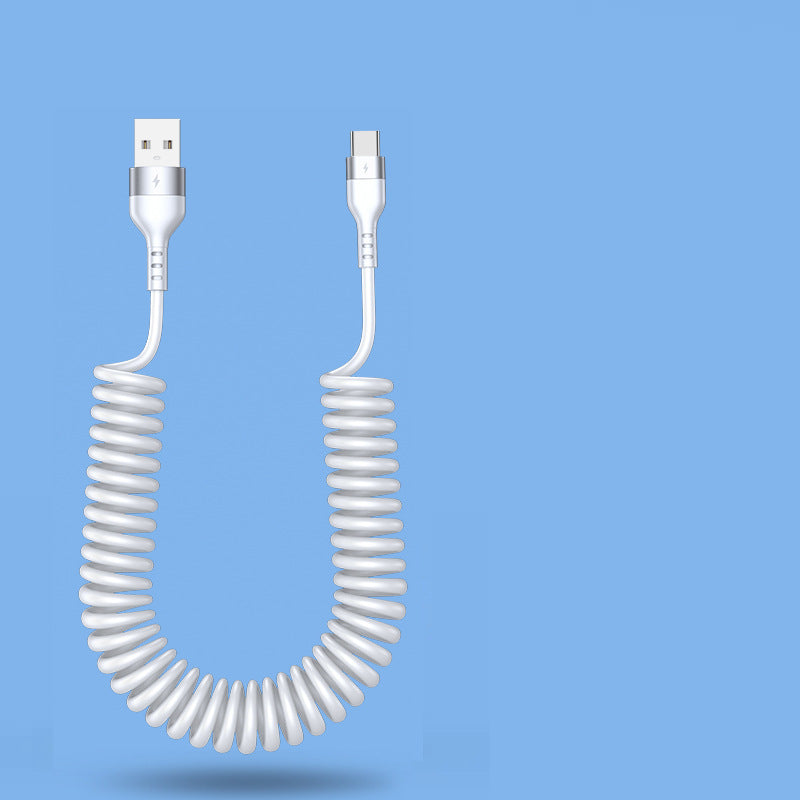 Coiled white USB cable on a blue background