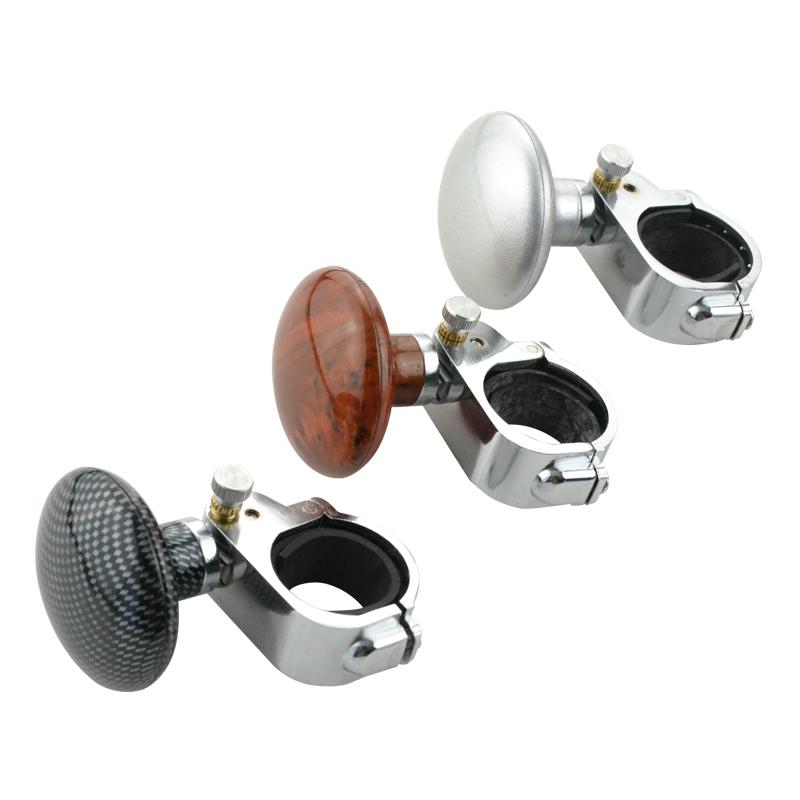Set of three guitar tuners with different finishes on a white background