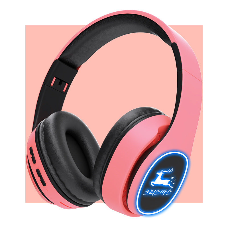 Pink and black headphones with a blue logo on a pink background