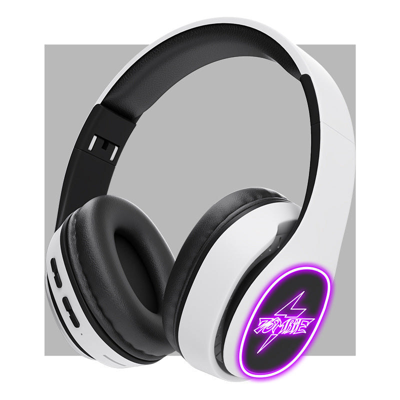 White gaming headset with black ear cushions and purple LED lighting on a gray background