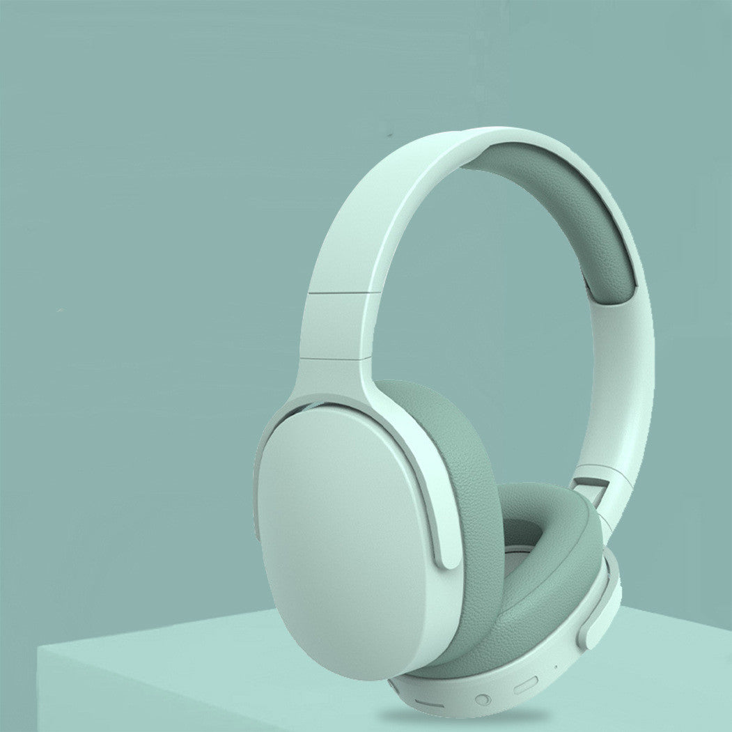 Pair of light gray headphones on a light blue background