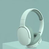 Pair of light gray headphones on a light blue background