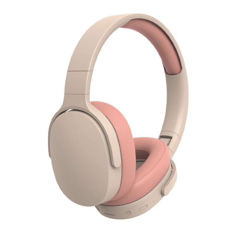 Beige and pink headphones on a white background