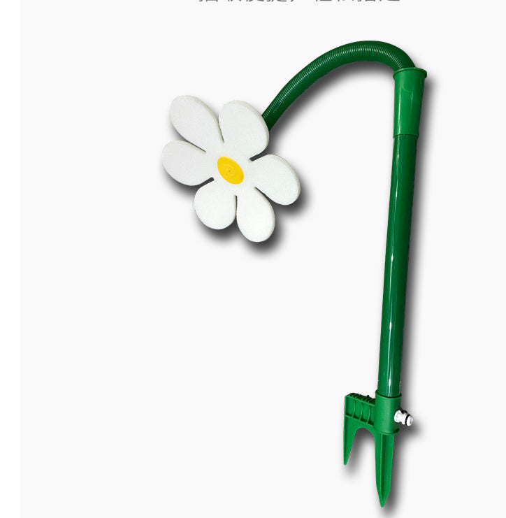 Green garden tool with a white flower design on a white background