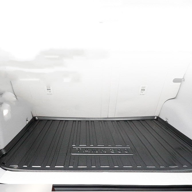 Car trunk with a black mat on a white background