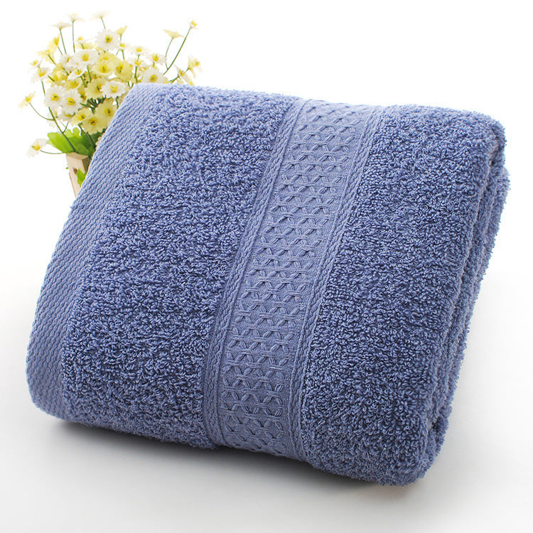 Rolled blue towel with textured pattern on a white background