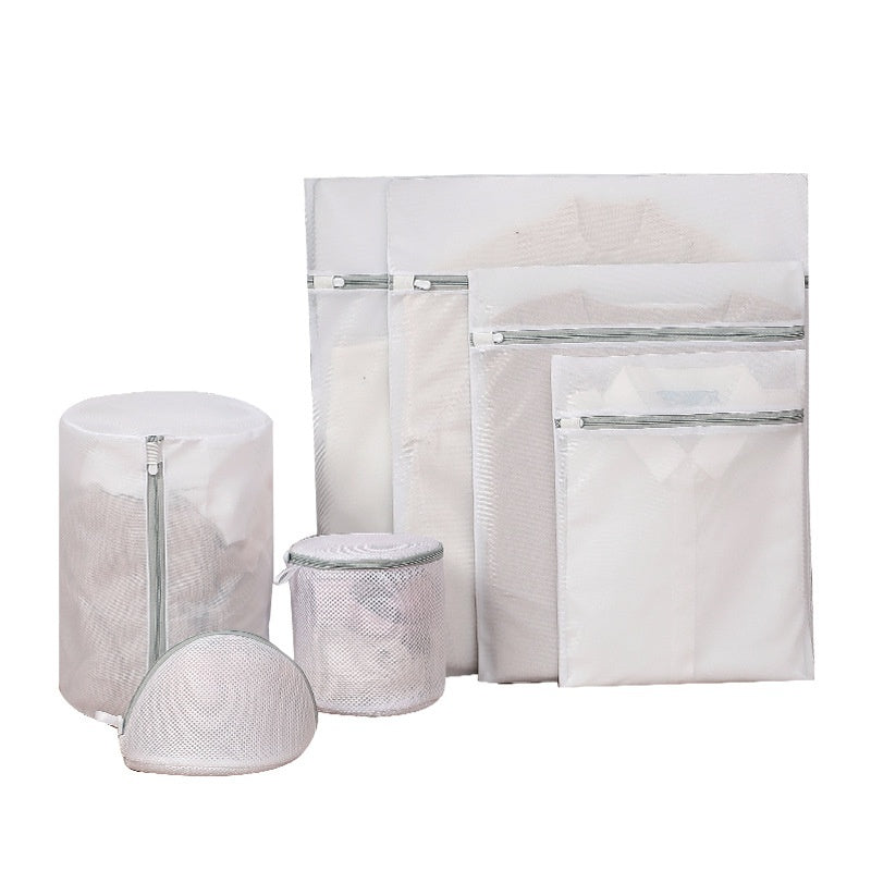Set of mesh laundry bags in various sizes on a white background