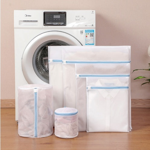 Laundry bags with a washing machine in the background