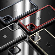 Various phone cases in black, red, gold, and silver on a reflective surface