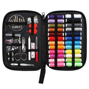 Sewing kit with colorful thread spools, scissors, and other tools in a black case.