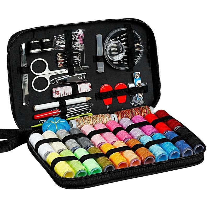Sewing kit with various tools and colorful thread spools in a black case.