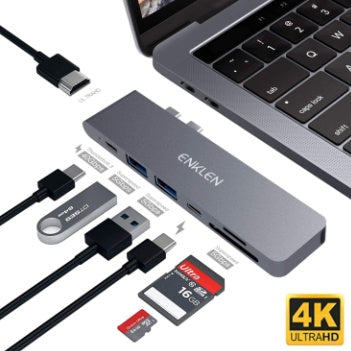 Hub adapter with multiple ports and cables on a white background