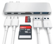 USB hub with multiple ports and cables on a white background