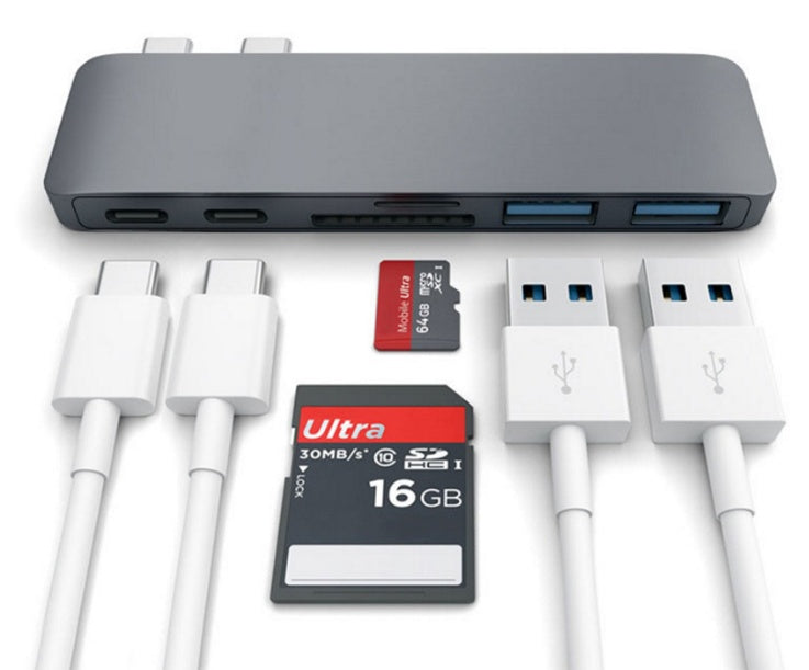USB hub with multiple ports, cables, and a 16GB memory card on a white background