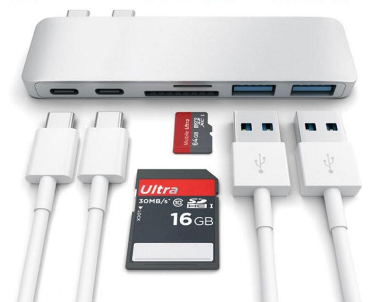 USB hub with multiple ports and cables on a white background