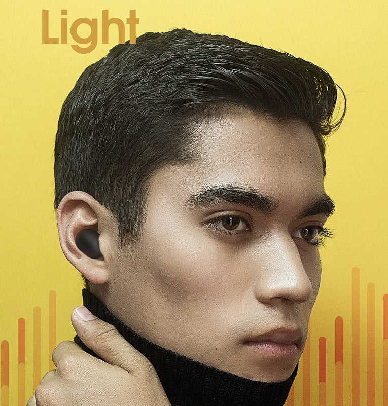 Person wearing a black turtleneck with a yellow background and 'Light' text