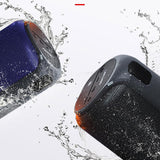 Two portable speakers, one blue and one black, with water splashes around them on a white background.