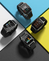 Four black smartwatches on a colorful geometric background