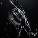 Smartwatch with water splashing around it on a black background