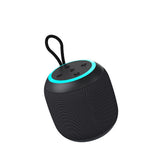 Black portable speaker with a blue accent on a white background