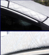 Car window sunshade with quilted design on a car window