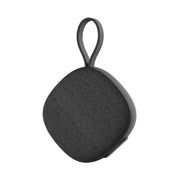 Black portable speaker with a handle on a white background
