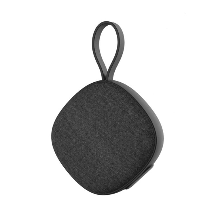 Black portable speaker with a handle on a white background