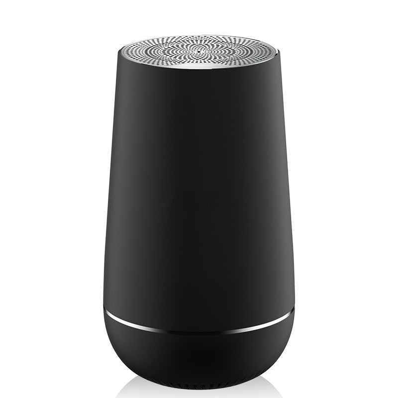 Black cylindrical device with a patterned top on a white background