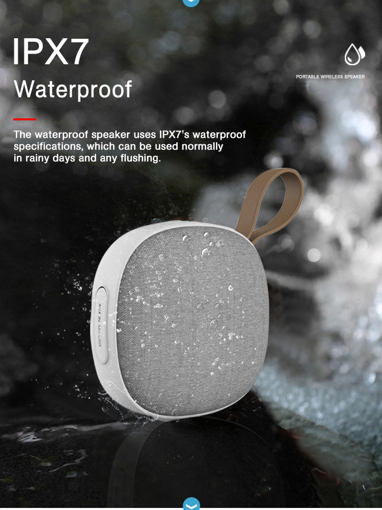 Waterproof speaker with IPX7 rating on a wet surface