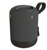 Black textured portable speaker with a handle on a white background