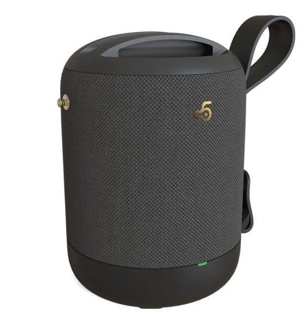 Black textured portable speaker with a handle on a white background