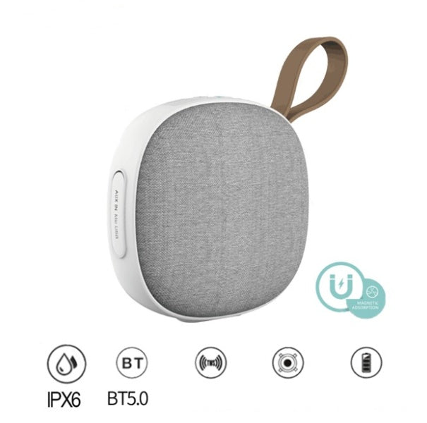 Portable speaker with gray fabric finish and white base on a white background