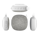 White and gray portable speaker with control buttons on a white background