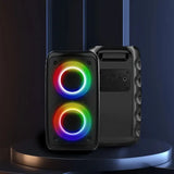 Black speaker with RGB lighting on a dark background