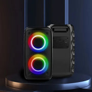 Black speaker with RGB lighting on a dark background