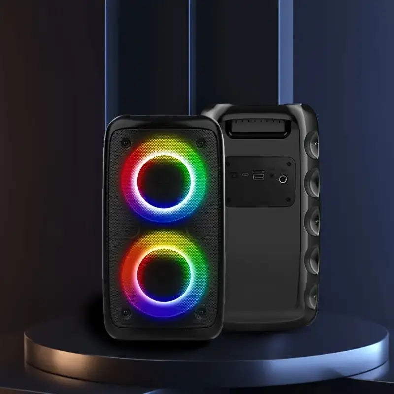 Black speaker with RGB lighting on a dark background