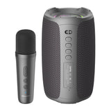 Gray portable speaker with microphone on a white background