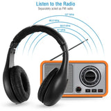 Black headphones with an orange and gray radio on a white background