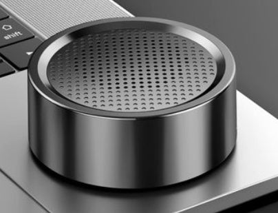 Metallic air freshener on a laptop keyboard