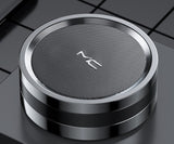 Wireless charging pad with 'NC' branding on a reflective surface