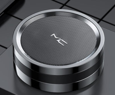 Wireless charging pad with 'NC' branding on a reflective surface